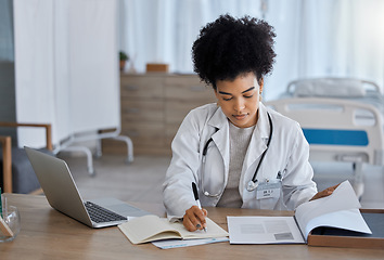 Image showing Black woman, laptop and doctor writing in notebook for healthcare test, study or research at the hospital. African American female medical expert taking notes in book for insurance, report or results