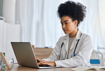 Image showing Doctor, laptop and research in office for healthcare, medicine and cancer surgery preparation, serious and focus. Black woman, health expert and online, internet and search for medical innovation