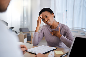 Image showing Black woman, doctor consultation and pain in chest, headache and explain for help, advice or medicine. African woman, patient and gesture to medic, nurse or healthcare expert for support in Atlanta