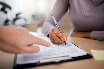 Image showing Healthcare, documents and writing with a patient hand using a pen in a doctor office for insurance information. Hospital, paper or contract with a black woman signing a form during medical consulting