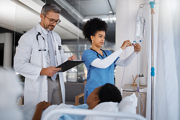 Image showing Doctor, nurse and patient in hospital, bed and clinic to check healthcare management, treatment and surgery. Surgeon writing medical notes, results and consulting nursing staff for iv drip medicine