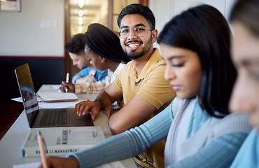 Image showing Education, university and students in lecture studying and learning business management. Scholarship, college and portrait of happy man with laptop, books and group of friends in modern classroom.