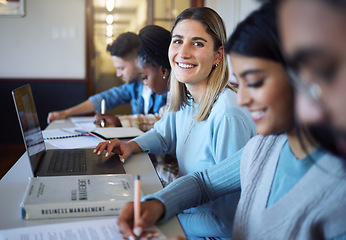 Image showing University, education and students in lecture learning and studying business management. College, education scholarship and portrait of happy girl with laptop, books and friends in modern classroom.