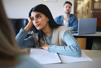 Image showing Student woman, classroom and thinking for education, college or learning for idea development. University, class lecture or female college student with daydream, bored and attention at desk in London