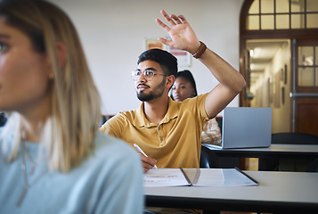 Image showing University student, hands and answer question in classroom for teaching, school education or learning. Young man, college student and raised hand for asking questions while studying in campus lecture