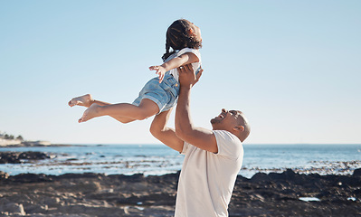 Image showing Beach, man holding girl in air and playful for vacation, summer and weekend break. Father swing daughter, relax and bonding at seaside, holiday and loving together for quality time, outdoor and smile