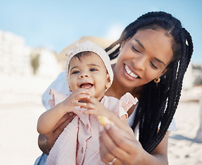 Image showing Food, mother and baby at a beach as a happy family on a fun picnic bonding, relaxing or eating on holiday in Brazil. Smile, mama and newborn child enjoys quality time at seashore on summer vacation