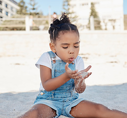 Image showing Play, child or girl in sand at a beach for fun summer holidays, vacation or weekend alone relaxing with freedom. Travel, nature or young kid toddler playing on seashore outdoors in Sao Paulo, Brazil