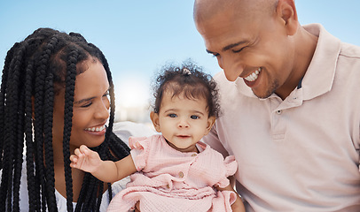 Image showing Mother, father and baby in nature as a happy family on summer holiday vacation in Rio de Janeiro, Brazil. Relaxed father, mom and cute newborn girl love enjoying fun quality time or bonding at beach