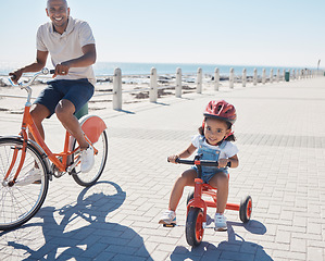 Image showing Family, portrait and cycling at the beach with girl and father on bicycle, happy and smile while learning, bond and having fun. Happy family, bike and parent with child at the sea for ride in nature