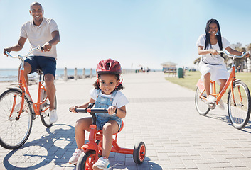 Image showing Cycling, bonding and family on the promenade with a bike for summer fitness, fun and quality time in Thailand. Learning, happiness and girl child with bicycle, mother and father at a park by the sea