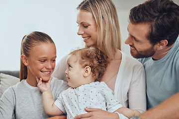 Image showing Family, baby and girl with father and mother in living room, having fun and bonding. Love, support and happy man, woman and kid with infant smiling, caring and enjoying quality time together in home.