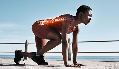 Image showing Start, running sports and black woman at beach getting ready for sprint, marathon or race. Spine x ray, training and female runner at seashore or promenade preparing for cardio workout or exercise.