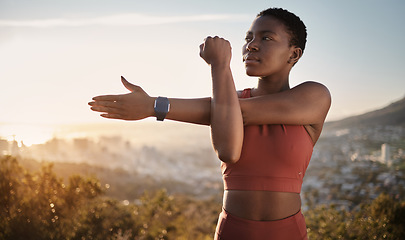 Image showing Exercise, fitness and black woman stretching arm outdoors for health and wellness. Thinking, sports training and female preparing, warm up and getting ready for cardio, workout or running at sunset.