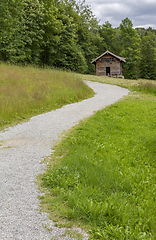 Image showing way and hut