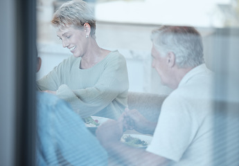 Image showing Love, celebration and family with dinner through window enjoy festive meal, lunch and eating food together. Christmas, thanksgiving and grandparents bonding, happy and laugh at dinner party at home