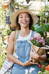 Image showing Flowers, happy and woman at a plant nursery shopping for floral products for her garden in nature. Happiness, smile and young female florist from Mexico buying a flower bouquet at sustainable market.
