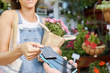 Image showing Customer, shopping and credit card for florist shop payment with POS machine or phone for sale of flowers at small business. Hands of woman paying with rfid technology for service at retail store