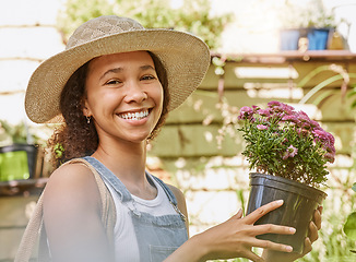 Image showing Face, flower pot and black woman shopping in floral shop or nursery. Portrait, sustainability and happy female gardener from South Africa with beautiful flowers after buying at plant store or market.