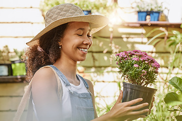 Image showing Woman, smile and flower pot plant while shopping at florist shop for buying gardening plants at a nursery and garden store. Black female or happy customer with flowers for sale in a greenhouse