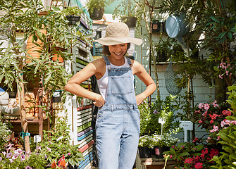 Image showing Gardening, plants and black woman happy working in flowers retail supermarket, nature agriculture and standing in small business shop. Gardener, smile and proud girl in greenhouse for herbs ecology