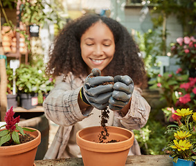 Image showing Black woman, garden and soil with plant and environment, happy gardener with dirt and nature, growth and sustainability. Spring, natural and gardening with earth, agriculture and compost for flowers.