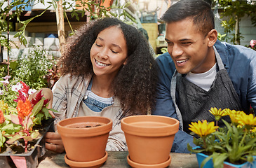 Image showing Gardening, flowers and couple working on plants in garden, outdoor nursery and sustainable greenhouse for boutique store. Spring growth, flowers bloom and growing in nature for sustainability florist