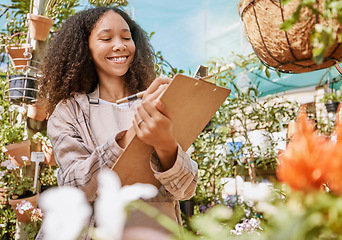 Image showing Small business, plants and black woman with inventory, quality control and checklist clipboard in nursery. Smile of satisfied business owner writing quality assurance notes in flower garden.