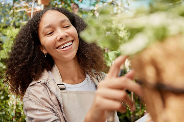 Image showing Plant shopping, happy and woman with a decision on flowers, retail garden and store for gardening product. Happiness, choice and business owner with inspection of ecology at a nursery or shop