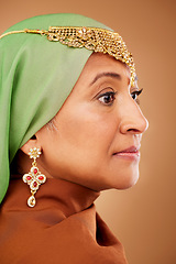 Image showing Face, beauty and fashion with a muslim woman in studio on a brown background for style or skincare. Luxury, wellness and makeup with an islamic female posing for her culture, heritage or tradition
