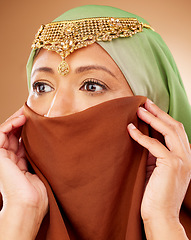 Image showing Muslim, skincare and woman with hijab in studio for beauty, wellness and cosmetic treatment on brown background. Islam, girl and model in face scarf relax with pamper, grooming and wellness in Dubai