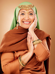 Image showing Beauty, fashion and jewellery with portrait of Muslim woman for Arabic, luxury and oriental designer. Gold, Islamic and culture with senior model for Eid Mubarak celebration, tradition and religion