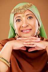 Image showing Portrait, Islamic woman and fashion with culture jewelry, head scarf and mature beauty on brown studio background. Senior female, Muslim lady and traditional outfit, Arabic aesthetic and cosmetics.