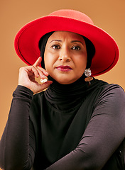 Image showing Muslim woman, fashion and hijab for islamic culture style with makeup, cosmetics and beauty of hijabi with a hat on a studio background. Face portrait model of Islam religion with vintage clothes