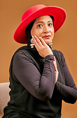 Image showing Fashion, stylish and senior Muslim woman with beauty, elegant clothes and vintage on a brown studio background. Designer clothing, classy and face portrait of an elderly model with fancy elegance