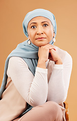 Image showing Muslim, beauty and fashion with senior woman in portrait, Islamic clothes with hijab against studio background. Cosmetics, serious and focus with wellness, spiritual with religion and Arab style.