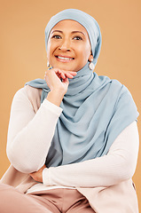 Image showing Mature muslim woman, face and fashion hijab on studio background with religion empowerment, traditional ideas or human rights innovation. Happy portrait, middle aged islamic model with Iranian scarf