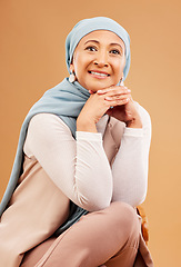 Image showing Hijab, fashion and senior Muslim woman with a smile, confidence and happiness on a brown studio background. Islam, happy and face portrait of an Arab, Islamic and modest elderly model with style