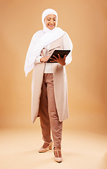 Image showing Happy muslim woman, tablet and technology on studio background for website, social network and internet app on studio background. Mature lady in islamic hijab search digital connection in Malaysia