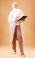 Image showing Fashion, muslim and woman with tablet in studio isolated on a brown background mock up. Technology, touchscreen and mature Islamic female thinking of internet browsing, social media or web scrolling.