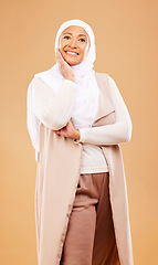 Image showing Fashion, beauty and portrait of muslim woman in studio isolated on an orange background. Skincare, cosmetics and mature Islamic female from Dubai in makeup posing in stylish hijab and modern clothes.