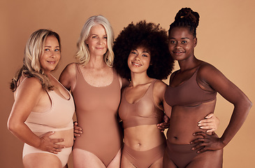 Image showing Beauty, diversity and women in lingerie hug in studio isolated on a brown background. Portrait, underwear or body positive group of friends in makeup or cosmetics embrace for self love or empowerment