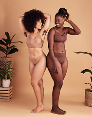 Image showing Diversity, body and natural with black woman friends in studio on a beige background for beauty or equality. Health, wellness and armpit hair with a model female and friend posing in underwear