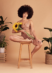 Image showing Self love, flowers and black woman in underwear for body positivity, beauty empowerment and body shape on a studio background. Creative, sunflower and portrait of a model with confidence in her skin