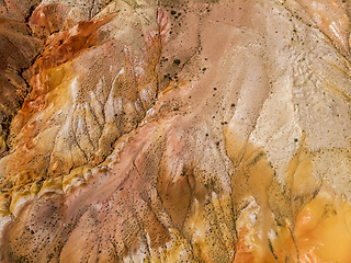 Image showing Aerial shot of the textured yellow nad red mountains resembling the surface of Mars