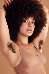 Image showing Armpit hair, body positivity and portrait of a black woman in studio on a brown background for natural care. Health, wellness and empowerment with an attractive young afro female showing her underarm