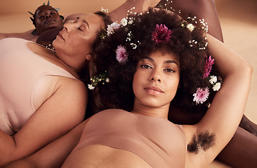 Image showing Armpit hair, confidence and floral black woman with natural beauty, body health and happy in skin with a group of women in studio. Creative, flower crown and portrait of a model with hairy underarm