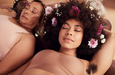 Image showing Flowers, sleep and face of women in studio relaxing for peace, beauty or zen. Floral makeup, organic cosmetics and diversity of body positive group of friends in underwear sleeping together on floor.