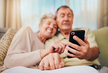 Image showing Relax, search and phone with old couple on sofa for communication, social media and internet. Bonding, rest and quality time with man and woman in home living room for digital, technology and mobile