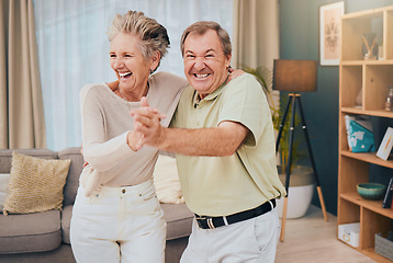 Image showing Happy, dance and senior couple in a living room, smile and fun while being silly in their home together. Happy family, love and man with woman dancing, laughing and goofy while enjoying retirement